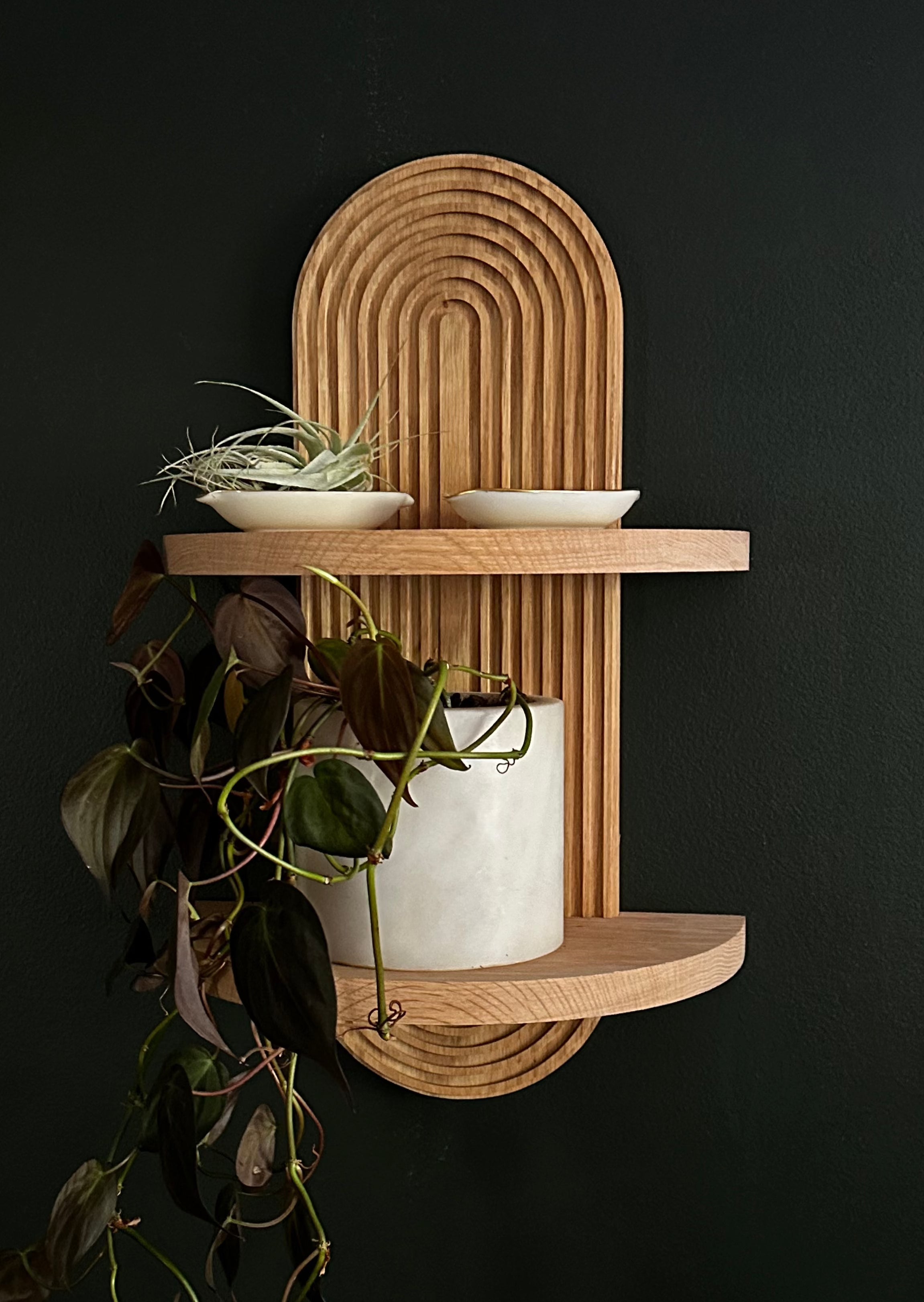 Wood floating shelf with arch design for small spaces, modern Scandinavian style. Versatile and stylish wall-mounted shelf for contemporary home decor.  