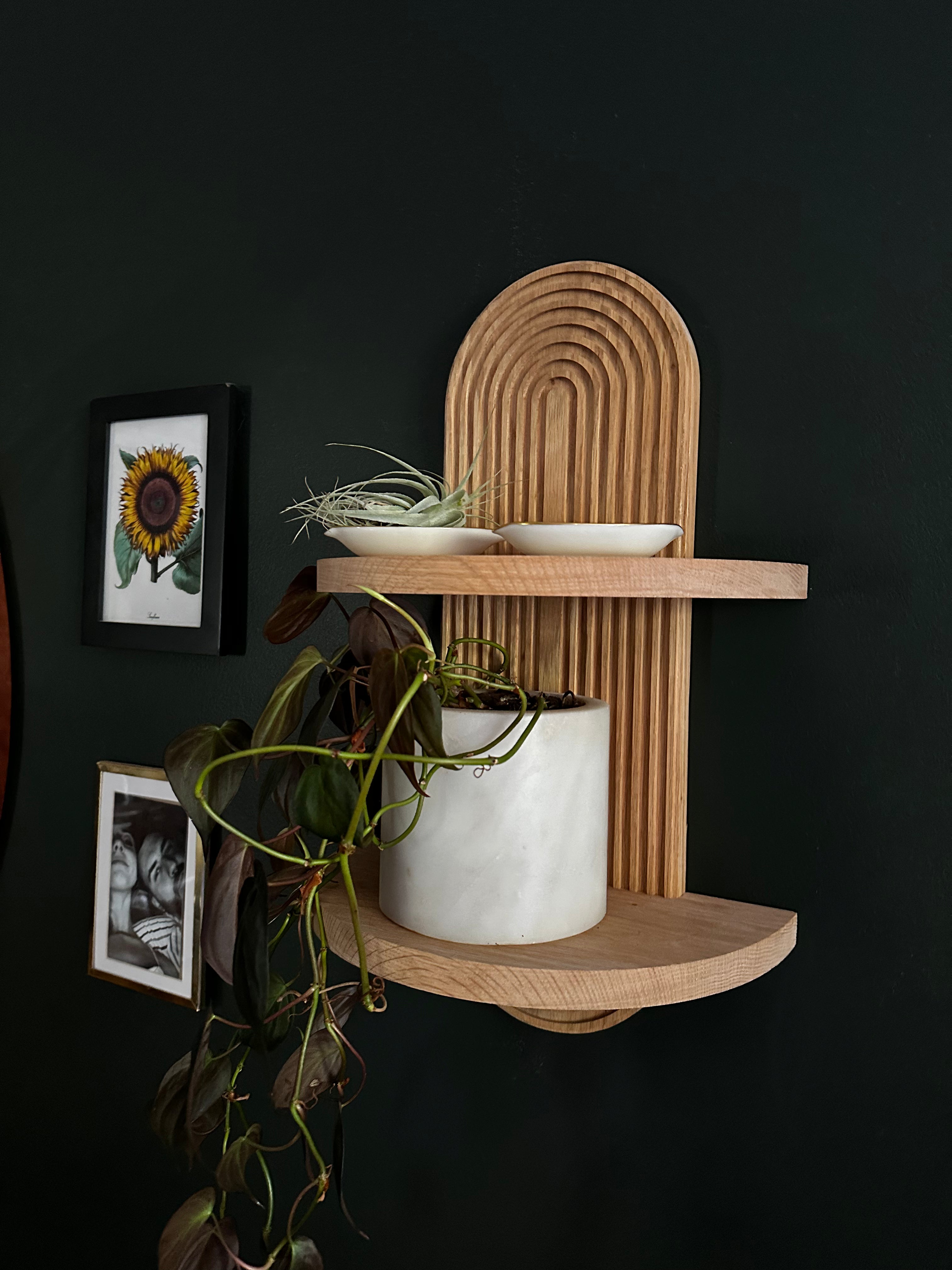 Wood floating shelf with arch design for small spaces, modern Scandinavian style. Versatile and stylish wall-mounted shelf for contemporary home decor.  