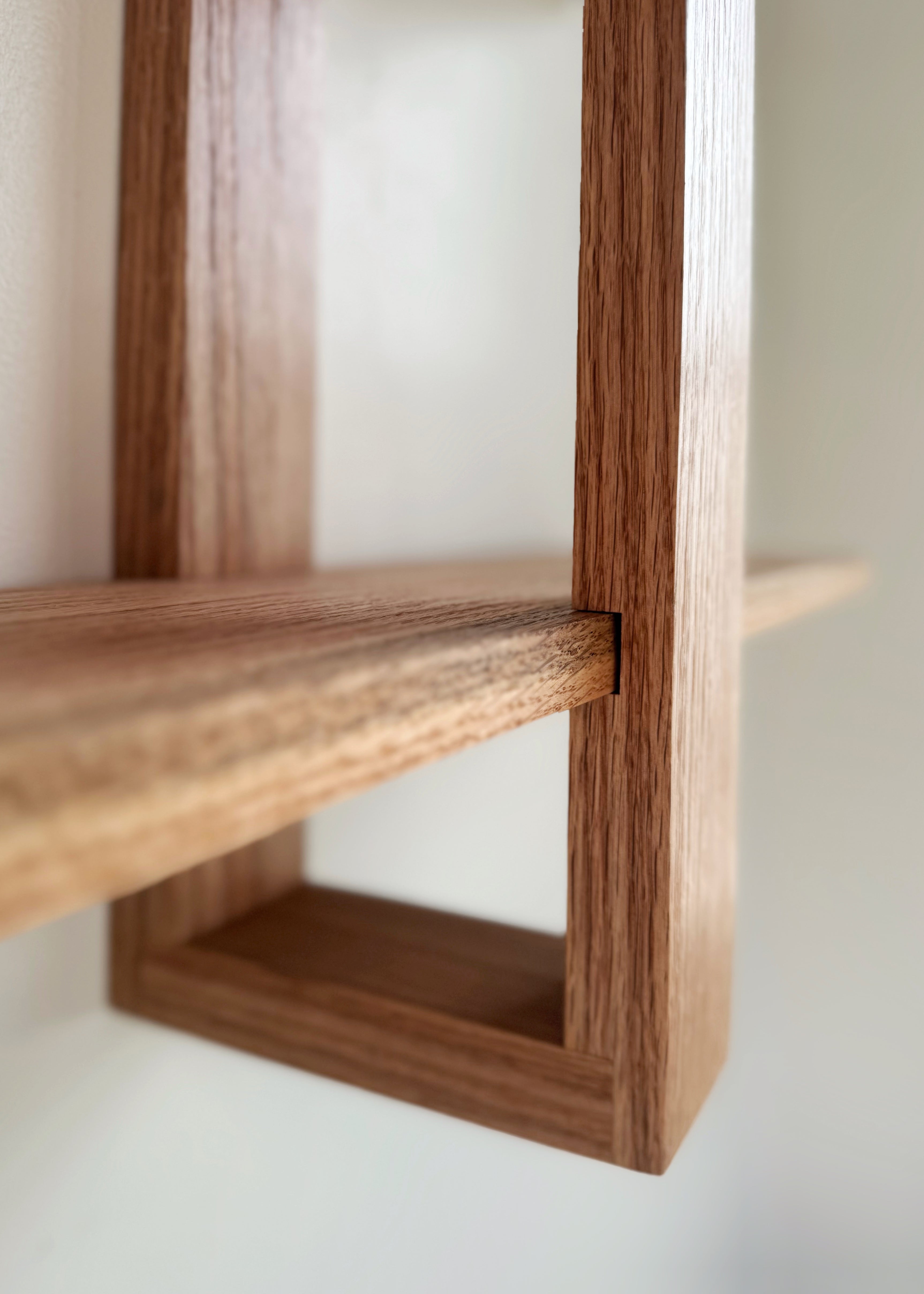 Wood floating shelf with adjustable shelves, modern Scandinavian style. Versatile and stylish wall-mounted storage solution for contemporary home decor.  