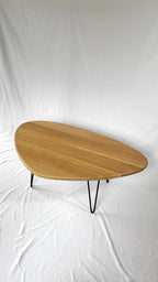 Kidney-shaped mid-century modern coffee table in natural wood