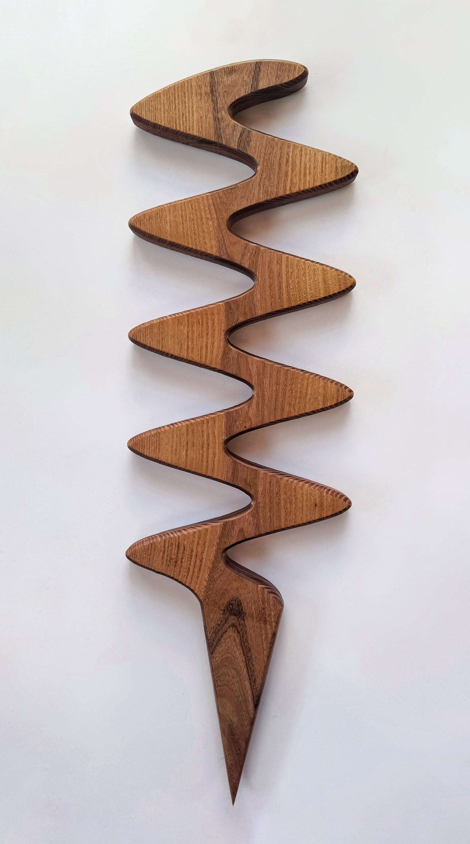 The Serpentine plant stake, a natural wooden climbing support for monstera, pothos, and other vining plants.