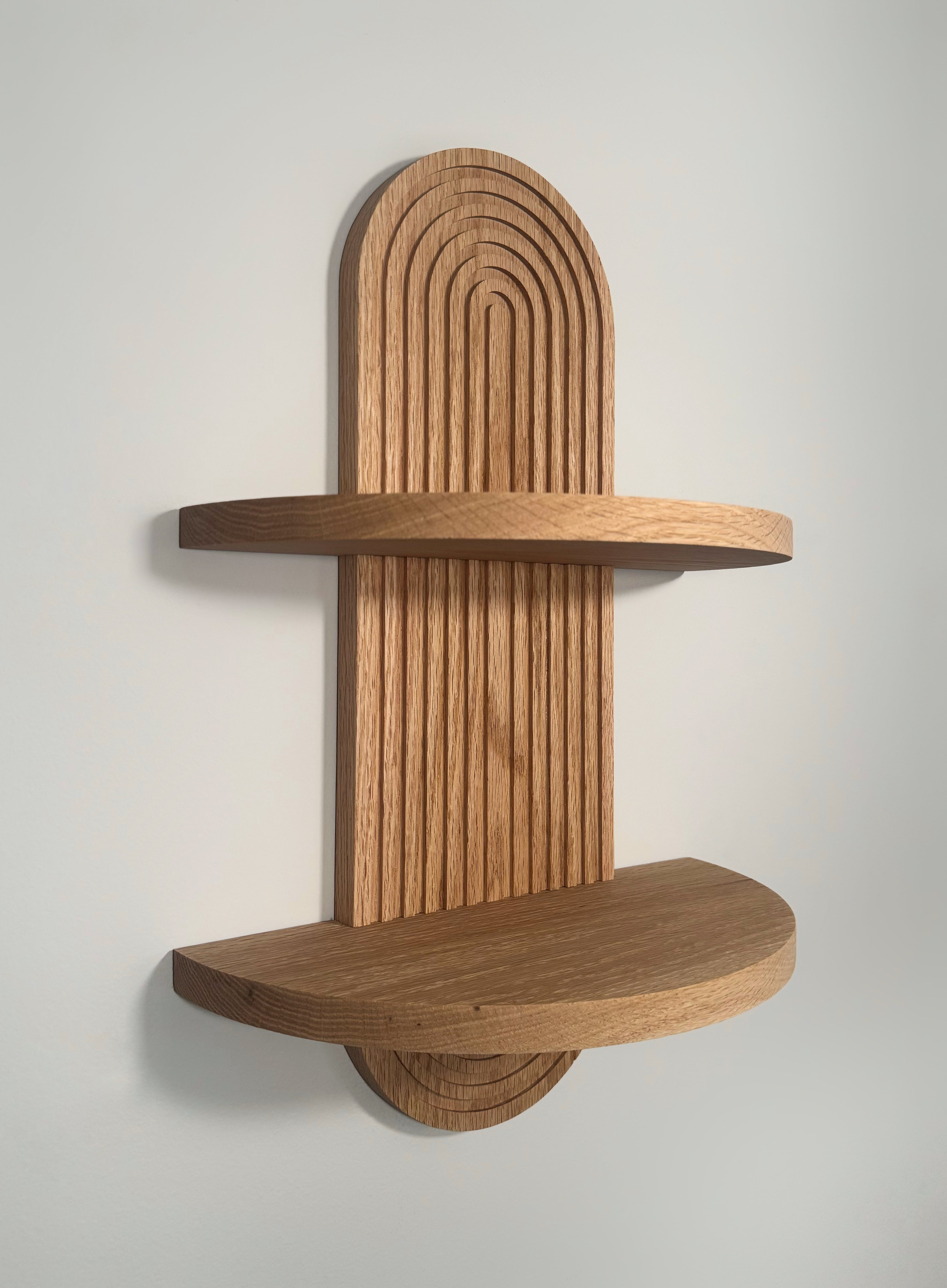 Handmade oak arch shelf with two shelves, perfect for plants, candles, or small decor. Floating design with keyhole mounts for easy installation.