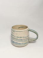 A blue and white marbled stoneware mug 