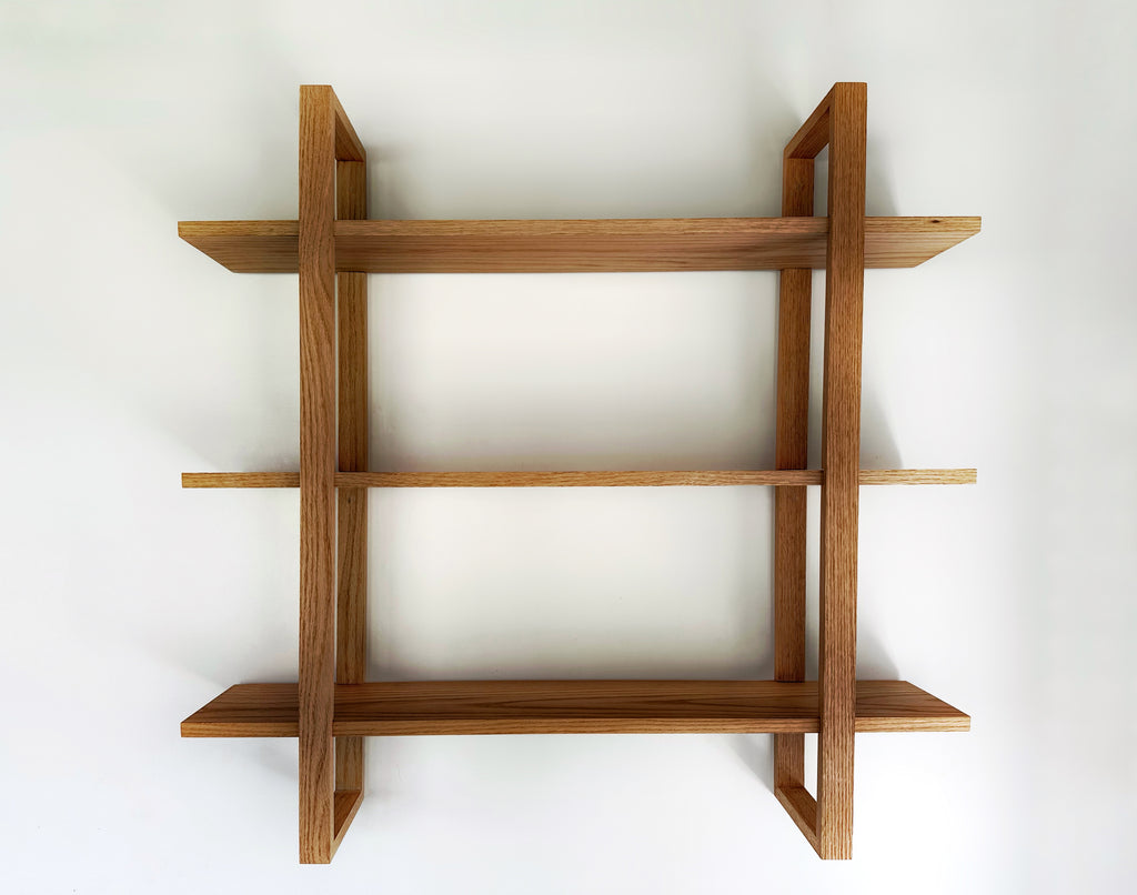 he Odyssey floating oak shelf with a modern bracket, inspired by Scandinavian minimalist design.