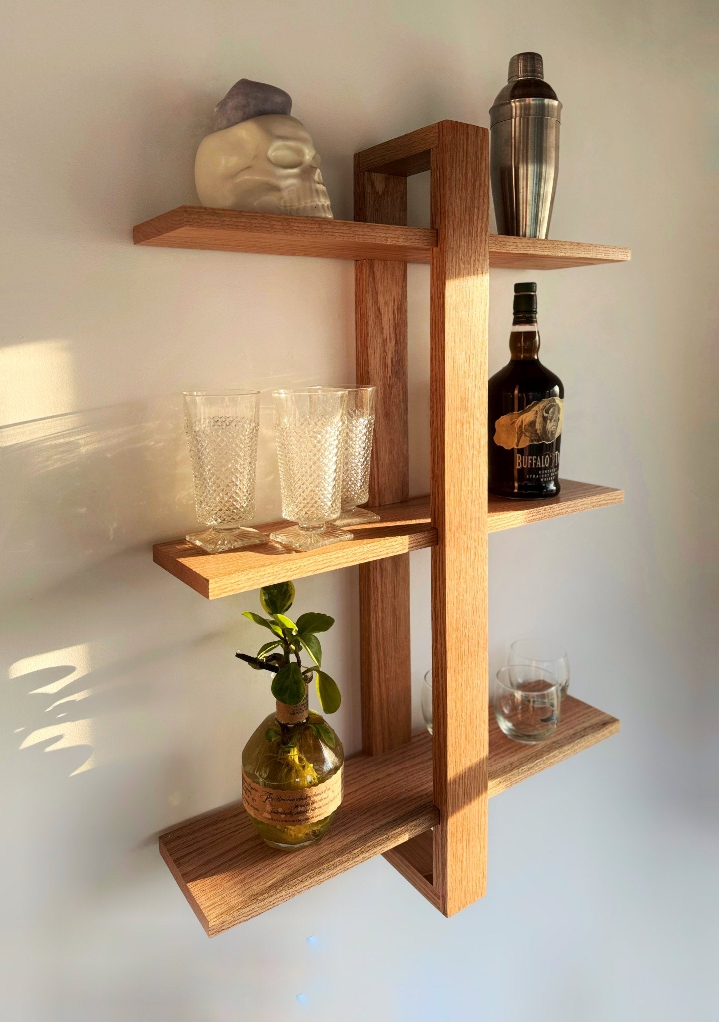 The Odyssey wall-mounted shelf – a Scandinavian-inspired oak floating shelf for books, decor, and plants
