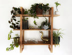 Handmade wooden wall shelf, The Crescent, featuring straight fluted brackets and a natural finish.