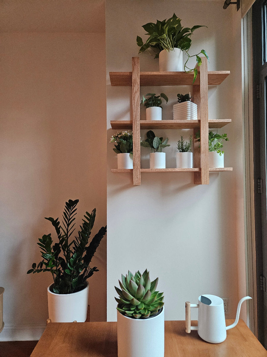 A minimalist solid wood floating shelf with a custom wall-mounted bracket, perfect for modern and contemporary home decor.