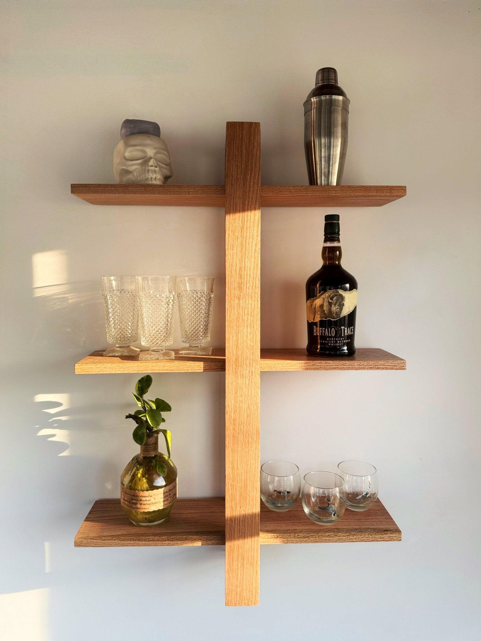 Minimalist Scandinavian floating shelf, The Odyssey, crafted from solid oak with a modern bracket.