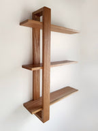 Handmade wooden shelf, The Odyssey, featuring a single bracket for a modern floating design.